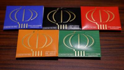 Ed Osmond - At Beijing Games, hugs discouraged but condoms available - channelnewsasia.com - China - Beijing -  Tokyo -  Seoul