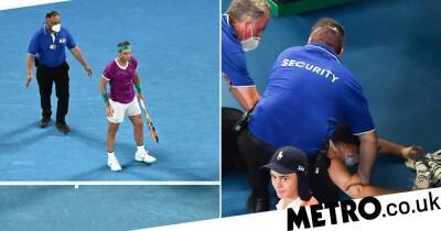 Australian Open final halted as security detain intruder who stormed onto the court