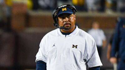 Michigan assistant coach Mike Hart 'trending in a positive direction' after medical emergency