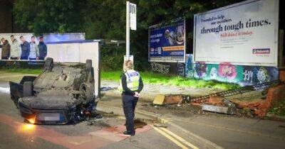 Man, 23, arrested after Audi hits pedestrian and flips onto roof during police chase