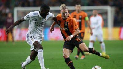 Soccer-Late Rudiger header rescues draw for Real against Shakhtar, sealing qualification
