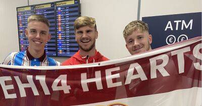 Beaming Timo Werner poses with Hearts flag after ending Celtic Champions League dream