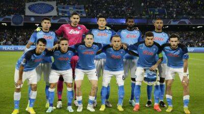 Soccer-Napoli sink Ajax to keep up 100% record and reach last 16