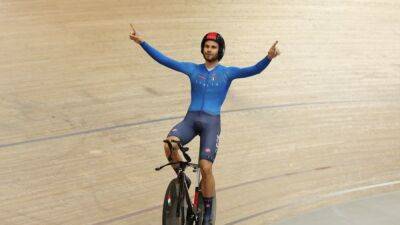 Cycling-Ganna storms to fifth men's pursuit title in world record time