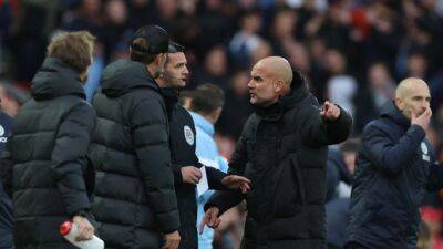 Soccer-Guardiola says coins were thrown at him in Liverpool loss