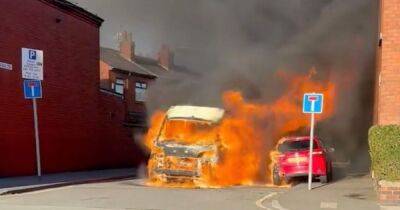 Moment woman fears husband is trapped inside 'exploding' van that burst into roaring flames in middle of quiet street