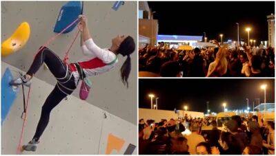 Elnaz Rekabi: 'Missing' sports climber shown arriving in Iran to cheering crowds