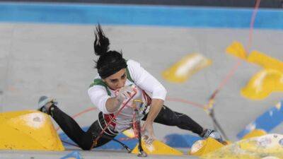 Iranian Athlete Greeted As Hero After Competing Without Hijab