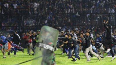 129 dead at Indonesian soccer match after police tear gas causes clashing fans to stampede - cbc.ca - Indonesia