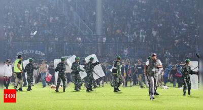 Explainer: What's behind Indonesia's deadly soccer match - timesofindia.indiatimes.com - Indonesia