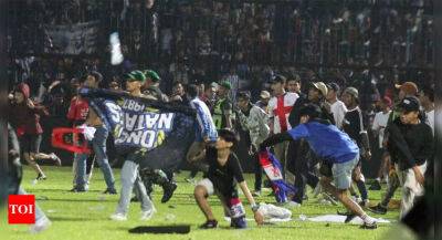 Indonesia stadium stampede death toll revised down to 125: Official - timesofindia.indiatimes.com - Indonesia