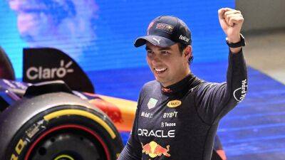 Max Vestappen's champagne on ice as Sergio Perez wins rain-delayed Singapore Grand Prix
