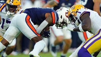 LSU's Sevyn Banks leaves game on stretcher after hard hit on opening kickoff