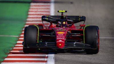 Motor racing-Ferrari drivers on top in US GP practice sessions
