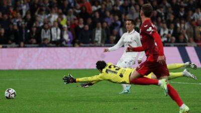 Soccer-Real Madrid score two late goals to win 3-1 against Sevilla