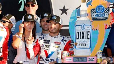 Larson wins NASCAR at Homestead, holding off Chastain at end