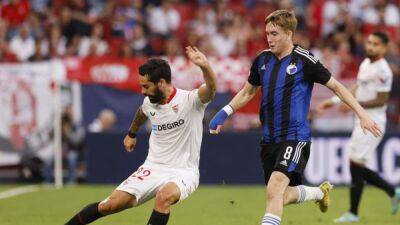 Sevilla sink Copenhagen 3-0 to stay alive in Champions League