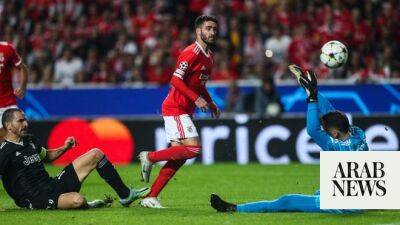 Benfica win thriller with Juventus to reach Champions League knockouts