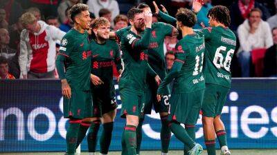 Liverpool advance after sweeping aside Ajax