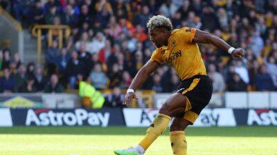 Soccer-Wolves speedster Traore challenges fans to race in car park