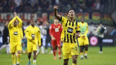Soccer-Bellingham goal gives Dortmund 2-1 win at Eintracht