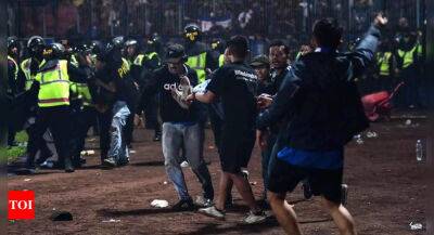 Seventeen children among the dead in Indonesian football stampede