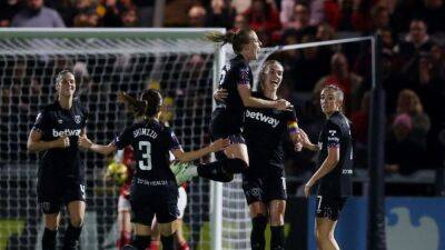 Soccer-Arsenal beat West Ham but Manchester United go top of WSL