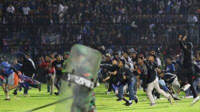 Indonesian police to charge 6 people in soccer disaster that led to 131 deaths