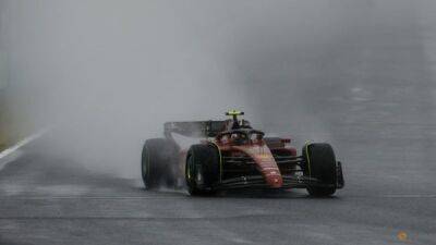 Motor racing-Alonso sets wet F1 practice pace in Japan