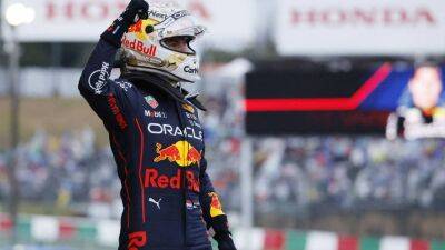 Max Verstappen retains F1 title after dominating rain-hit Japanese Grand Prix