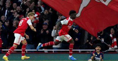 Arsenal back to summit after thrilling win over Liverpool