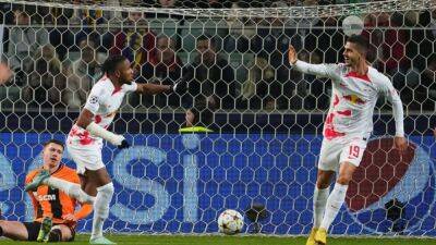 Soccer-Leipzig cruise past Shakhtar to reach Champions League last 16
