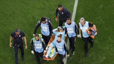 Iran keeper carried off after suffering head injury - channelnewsasia.com -  Doha - Iran