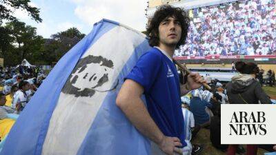 Fans at World Cup pay homage to football great Diego Maradona with shirts and chants