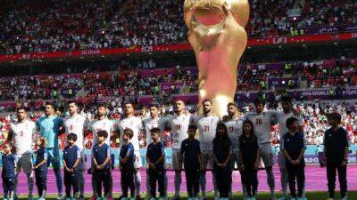 Iran players sing national anthem at World Cup match