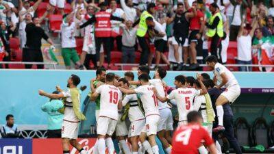 Last-gasp double keeps Iran in World Cup after Wales thriller