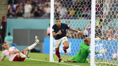 Mbappe double leads France past Denmark into last 16