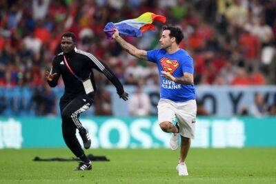PICS | Man with rainbow flag invades pitch during Portugal-Uruguay World Cup game
