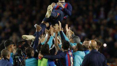 Robert Lewandowski - Gerard Piqué - Barcelona bid farewell to emotional Pique with win over Almeria - channelnewsasia.com