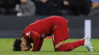 Liverpool's Salah strikes twice to down battling Spurs