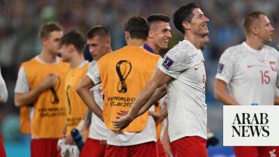 Lewandowski celebrates ‘happy defeat’ as Poland go through to next round
