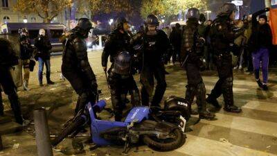 Morocco, France fans clash with police in Paris after World Cup win