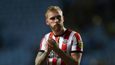 Sheffield United's McBurnie cleared of assaulting a fan