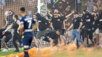 A-League Melbourne derby abandoned after chaotic pitch invasion