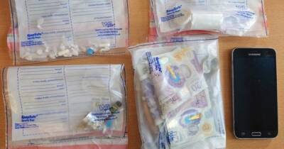 Woman, 32, arrested in Wigan on suspicion of dealing drugs as police 'seize pills, cash and paraphernalia' - manchestereveningnews.co.uk