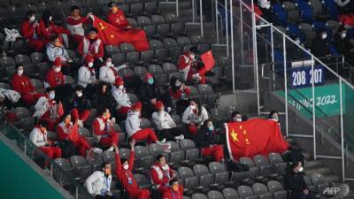 Beijing Winter Olympics venues slowly add spectators - and a bit of buzz