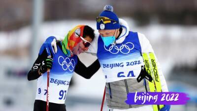 Olympic champion Iivo Niskanen waits to congratulate last-placed skier in show of respect