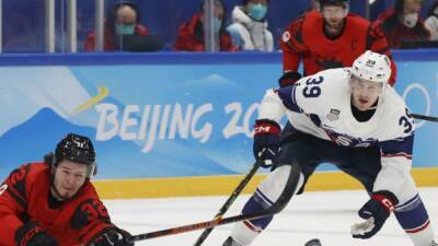 Ice hockey-US speeds past Canada to top of Group A