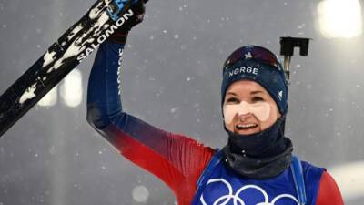 Winter Olympics: Norway's Marte Olsbu Roeiseland wins third gold in biathlon