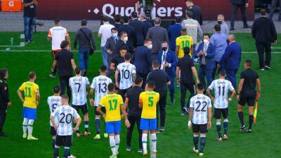 FIFA rule that the abandoned Brazil vs Argentina clash be replayed and four players receive two-match bans